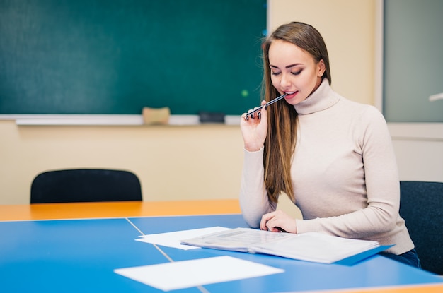 Premium Photo Pretty female school teacher working in office