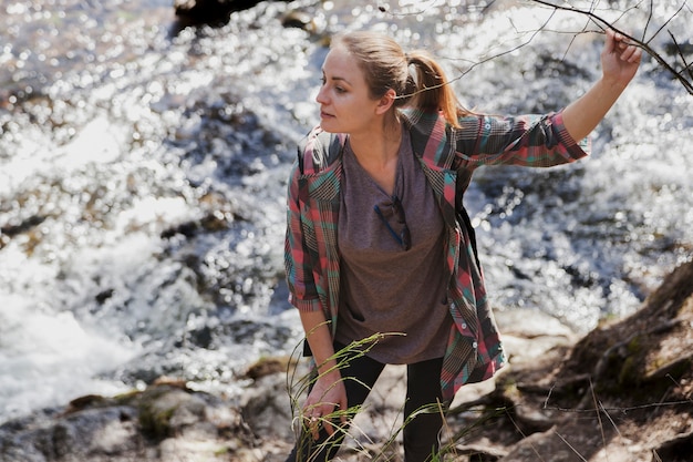 Free Photo | Pretty girl posing with river background