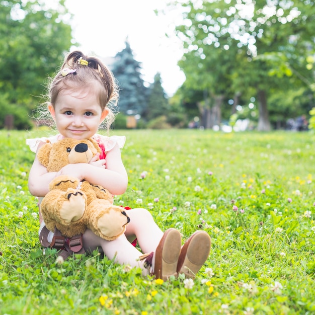 cuddling a teddy bear