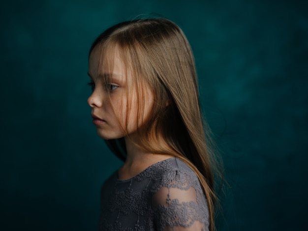 Premium Photo | Pretty little girl in gray dress loose hair portrait ...