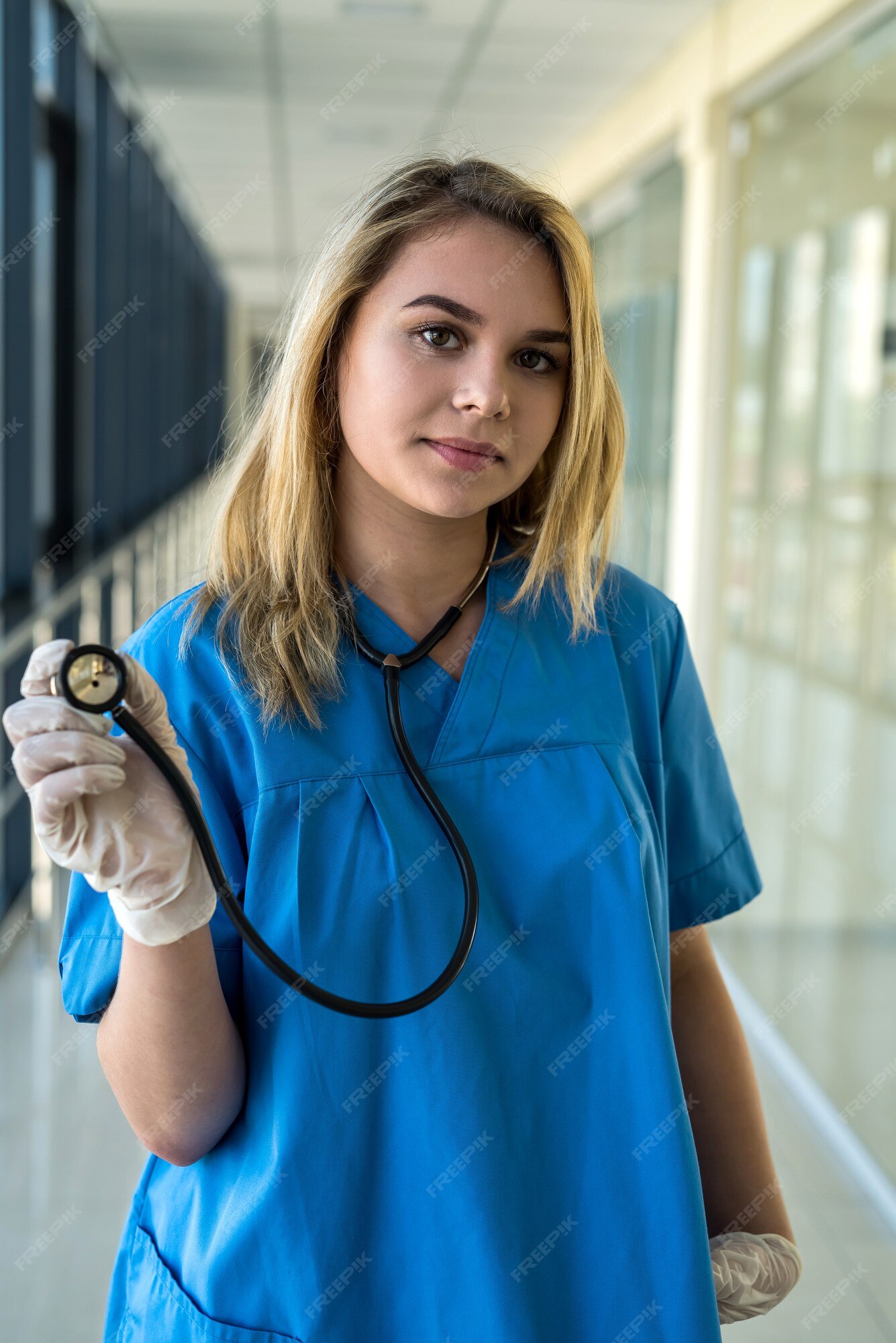 Premium Photo Pretty Nurse In Blue Uniform With Stetoscope Indoors In