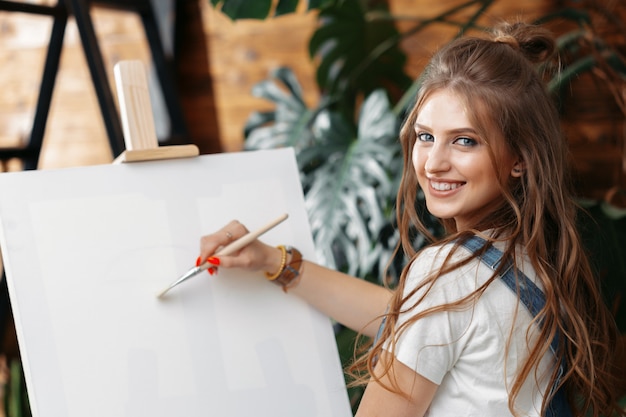 Premium Photo Pretty Talented Female Painter Painting On Easel   Pretty Talented Female Painter Painting Easel 93675 37024 