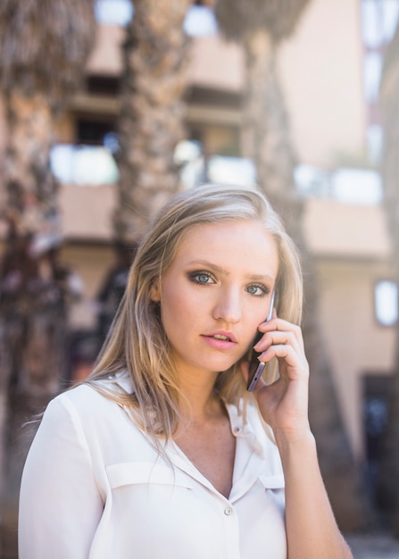 Pretty woman talking on cell phone | Free Photo