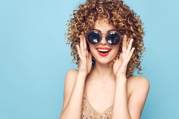 Premium Photo | Pretty woman with curly hair and glasses