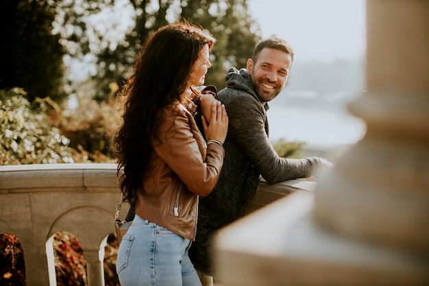 Premium Photo Pretty Young Couple On The Balcony In Autumn Park 1855