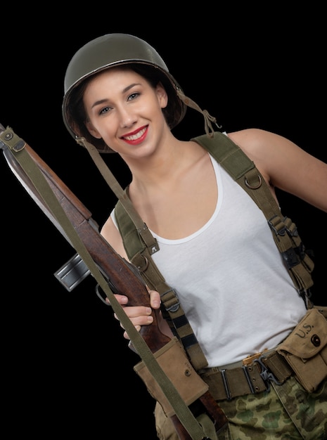 Premium Photo A Pretty Young Woman Dressed In Wwii American Military Uniform With Helmet And Rifle