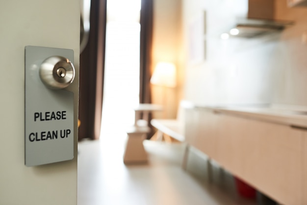 Privacy Sign Hanging On Handle Of Open Door To Hotel Room Photo