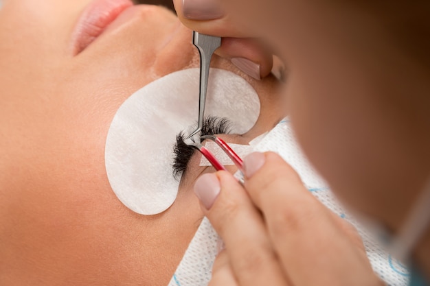 Procedure of eyelashes extension Premium Photo