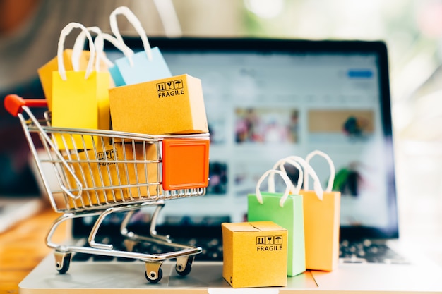 product package boxes shopping bag cart with laptop online shopping delivery concept 38716 138 - Apa Itu TKI? Apa Saja Keuntungan Jadi TKI? Temukan Jawabannya di Sini