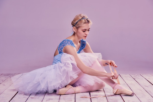 ballerina putting on shoes