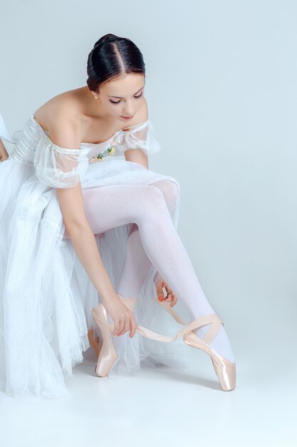ballerina putting on shoes