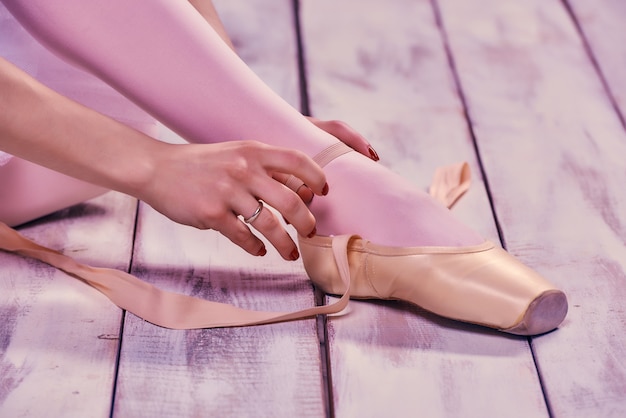 ballerina putting on shoes