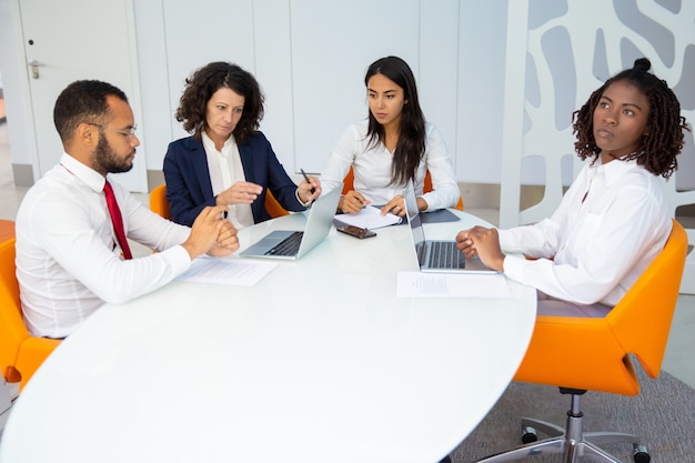 Professional business team with laptops and papers Free Photo