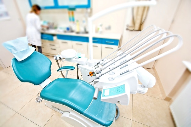 Professional Dentist tools and chair in the dental office.  Photo | Free Download