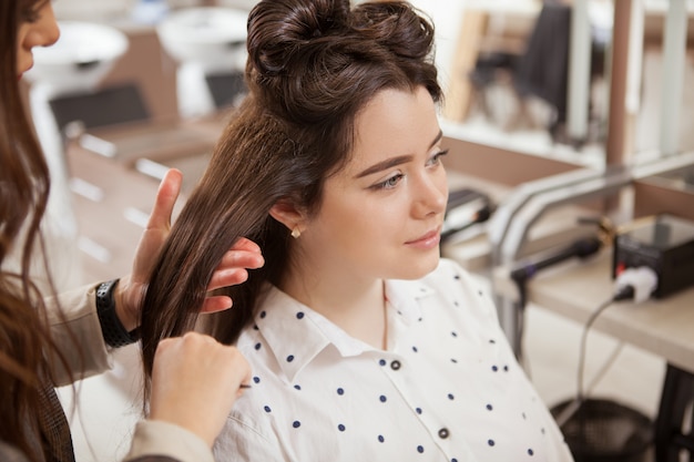 Premium Photo | Professional hairstylist working at a hair salon