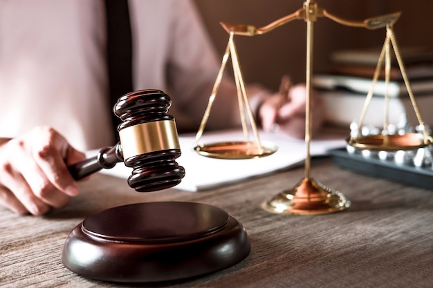 Premium Photo | Professional male lawyers working on courtroom sitting ...