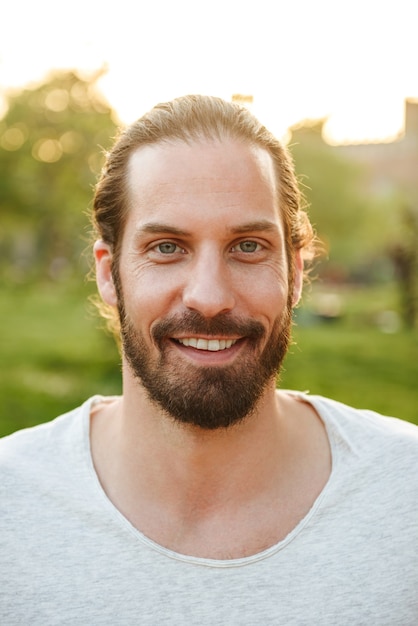 Premium Photo | Profile closeup of handsome bearded man 30s with tied ...