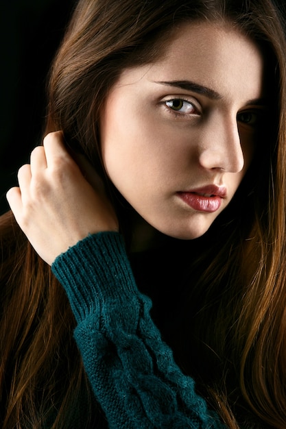 Profile of young girl with long brown hair  Free Photo