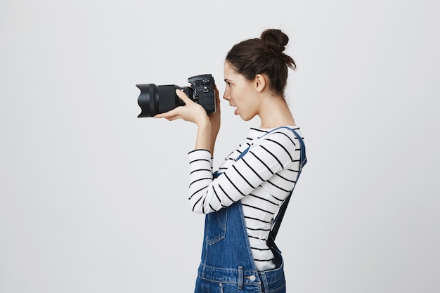 Free Photo | Profile portrait of pretty girl photographer looking ...