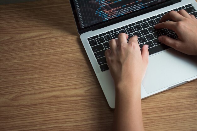 Programmers work on laptops at the office. that is programming code. Premium Photo