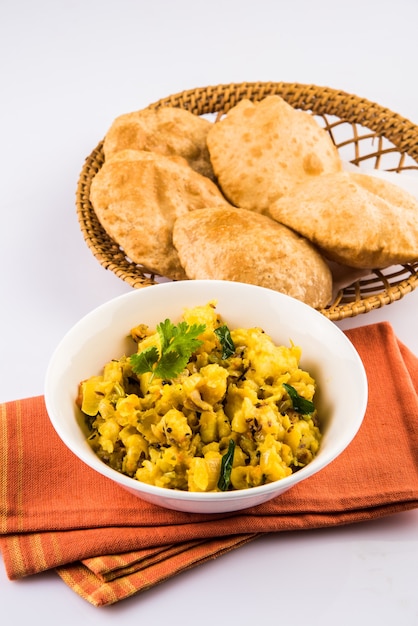 Premium Photo | Puri bhaji - indian semi dry potato spicy recipe also ...