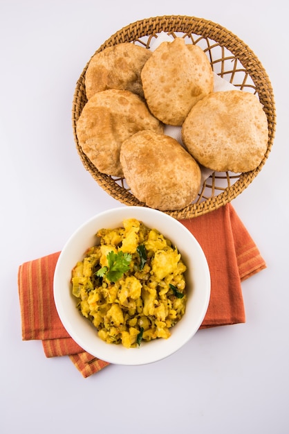 Premium Photo | Puri bhaji - indian semi dry potato spicy recipe also ...