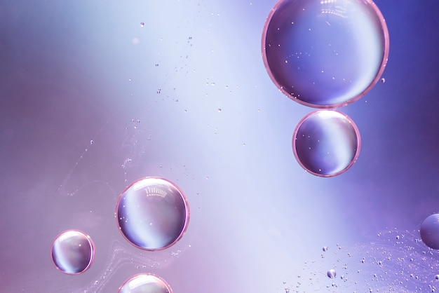 Purple abstract background with bubbles Photo | Free Download