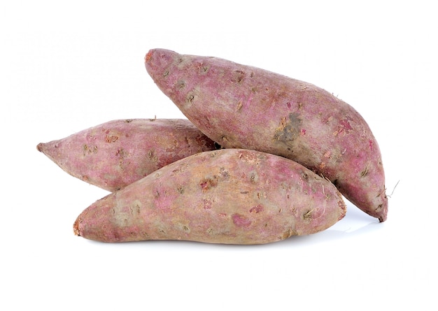 Premium Photo | Purple colored sweet potatoes on white background