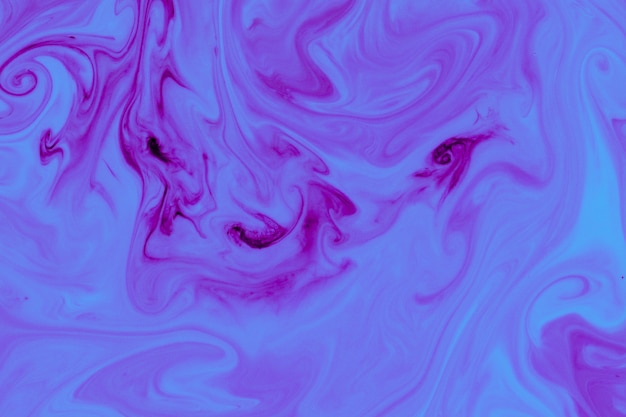 Purple liquid paint abstract background Free Photo
