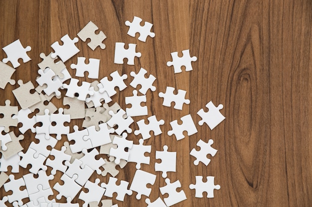 Puzzle Pieces On Wooden Table Photo Free Download