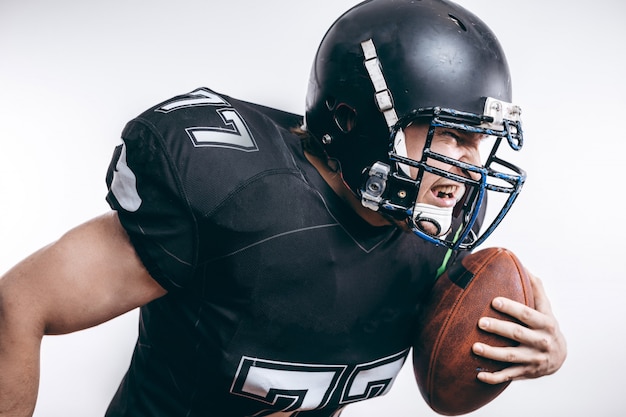 Premium Photo | Quarterback throwing a football in a professional