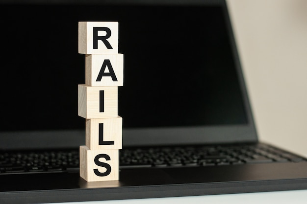 premium-photo-rails-text-written-on-wooden-block-on-computer-keyboard