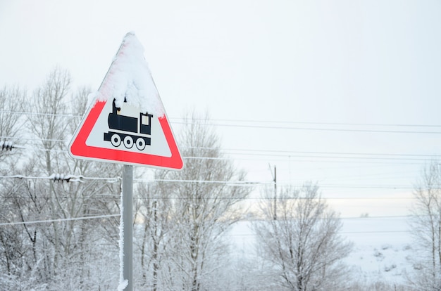 Premium Photo Railway Crossing Without Barrier A Road Sign Depicting An Old Black Locomotive Located In A Red Triangle