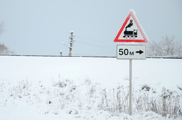 Premium Photo Railway Crossing Without Barrier A Road Sign Depicting An Old Black Locomotive Located In A Red Triangle