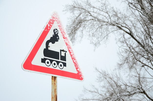 Premium Photo Railway Crossing Without Barrier A Road Sign Depicting An Old Black Locomotive