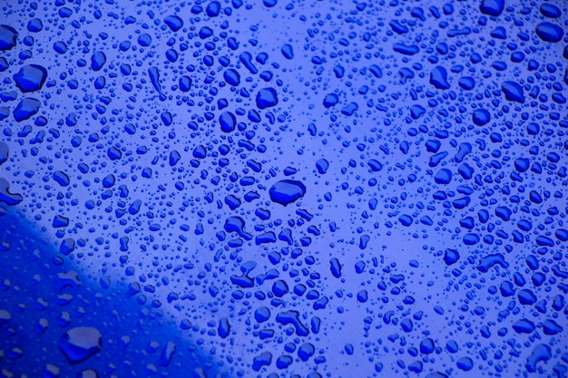 Premium Photo | Rain drops on the blue, blue color