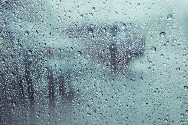 Premium Photo | Rain drops water on surface car window background, view ...