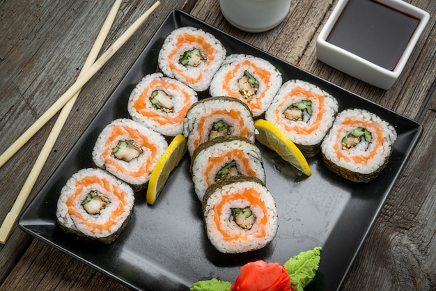 Premium Photo | Rainbow sushi roll with salmon, eel, tuna, avocado ...