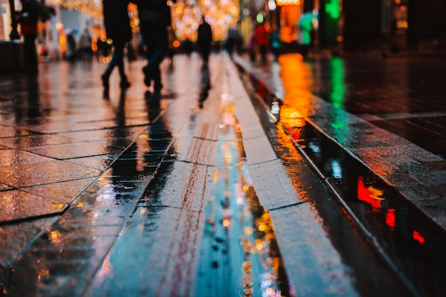 Premium Photo | Rainy night in a big city, reflections of lights on the ...