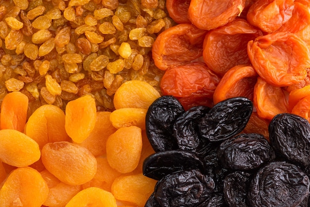 Premium Photo | Raisins, prunes, dried fruits as a background.