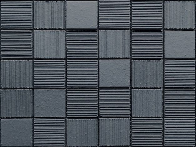 ランダムなモダンなデザインの正方形の石レンガブロックパターンテクスチャ壁 プレミアム写真