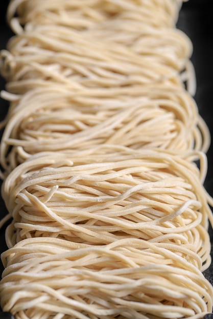 Premium Photo | Raw asian ramen noodle texture, egg noodle or mie ayam