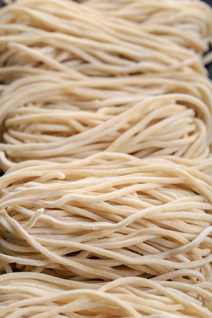 Premium Photo | Raw asian ramen noodle texture, egg noodle or mie ayam