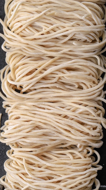 Premium Photo | Raw asian ramen noodle texture, egg noodle or mie ayam