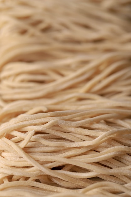 Premium Photo | Raw asian ramen noodle texture, egg noodle or mie ayam