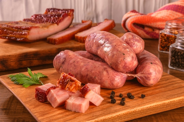 Premium Photo | Raw brazilian bacon sausages on the wooden board with ...