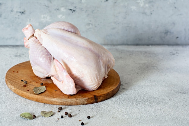 Premium Photo | Raw chicken carcass ready for cooking on a cutting