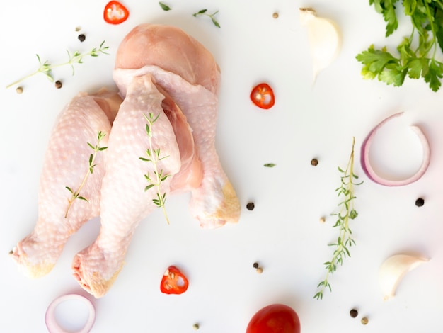 Raw chicken parts with different ingredients Photo | Free Download