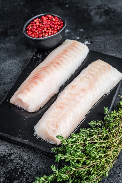 Premium Photo | Raw cod loin fillet fish on marble board