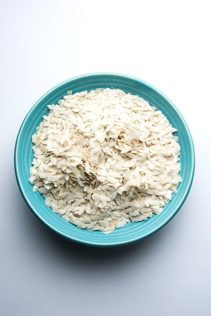 Premium Photo | Raw flattened rice or thick or thin rice flakes for ...